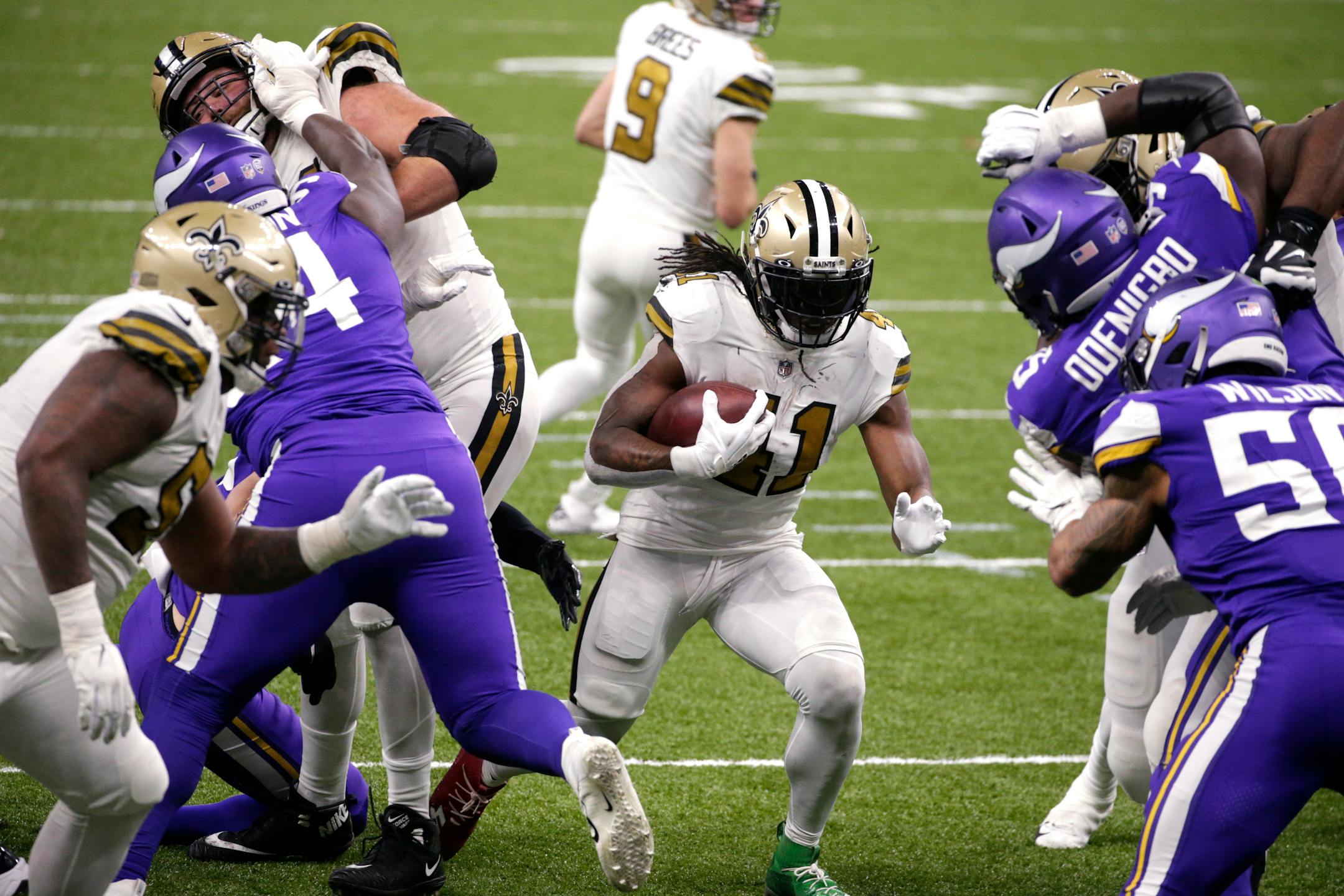 New Orleans Saints running back Alvin Kamara (41) carries for his fifth touchdown of the game, in the second half of an NFL football game against the Minnesota Vikings54 in New Orleans, Friday, Dec. 25, 2020. (AP Photo/Butch Dill)