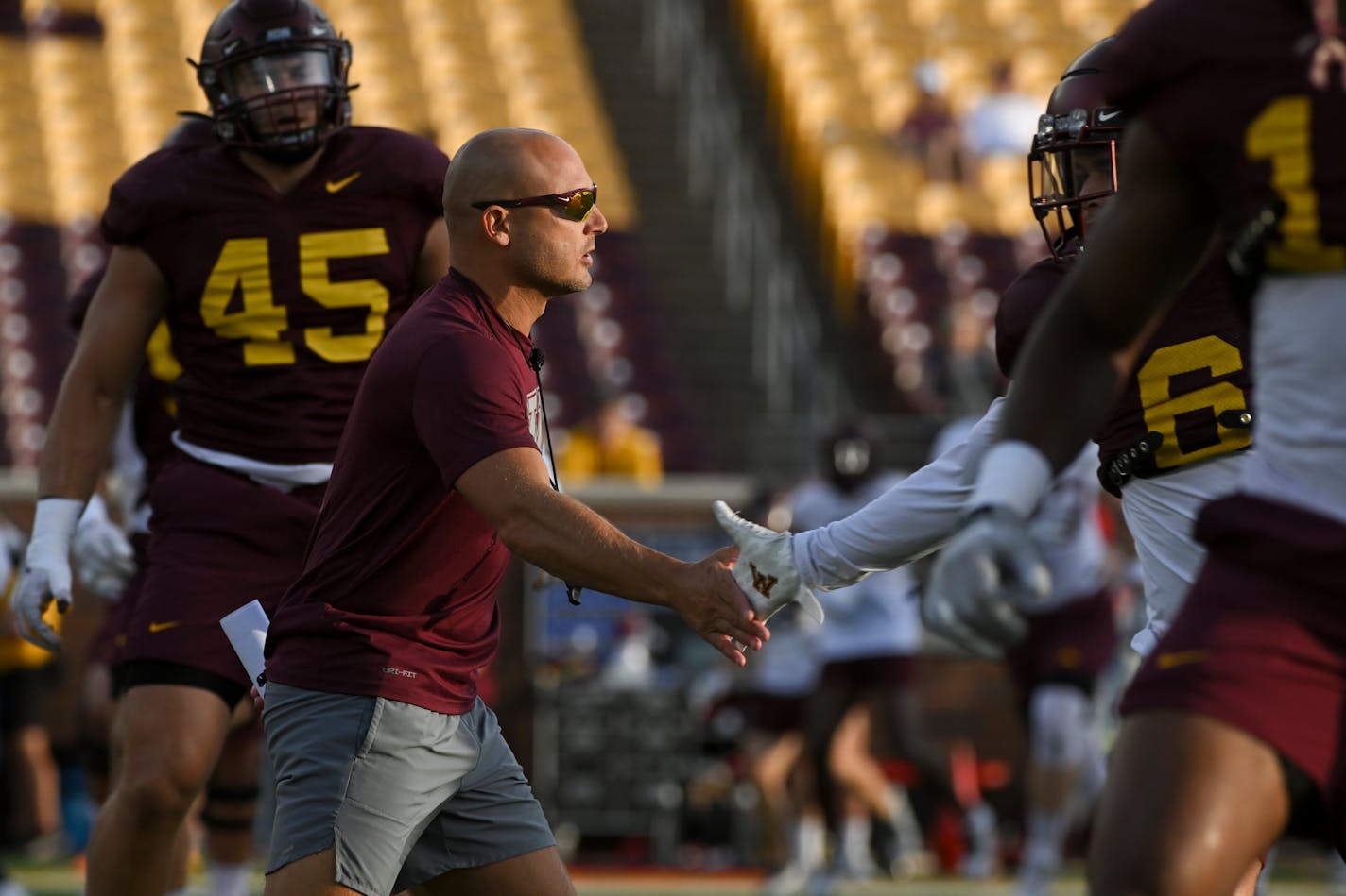 Minnesota Golden Gophers head coach P.J. Fleck high fives defensive back Miles Fleming (6) during a Minnesota Gophers open football practice Thursday, Aug. 11, 2022 at Huntington Bank Stadium in Minneapolis, Minn.. ] aaron.lavinsky@startribune.com