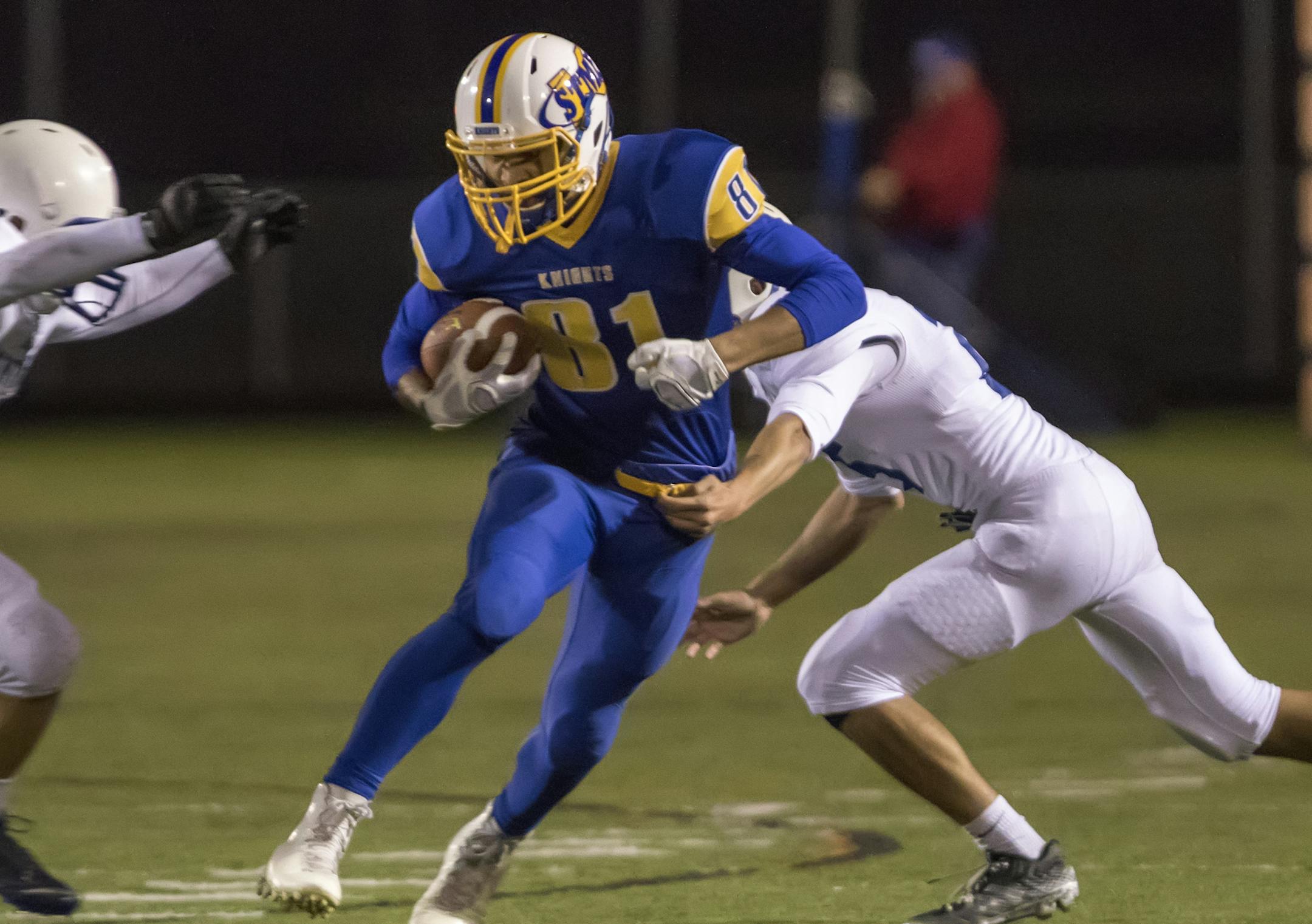 St. Michael-Albertville defensive back Isaiah Weston (81) advances the ball after a pass as the Spring Lake Park Panthers faced the St. Michael-Albertville Knights in the Class 5A MSHSL Football playoffs. ] MATT BLEWETT ï matt@mattebphoto.com - October 31, 2015, Osseo, MN, Spring Lake Park Panthers, St. Michael-Albertville Knights, Prep Football, Spring Lake Park Panthers vs St. Michael-Albertville Knights, 264495 PREP110115