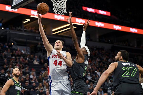 Detroit Pistons forward Bojan Bogdanovic (44) scores a layup during the first quarter against Minnesota Timberwolves forward Jaden McDaniels (3) Satur