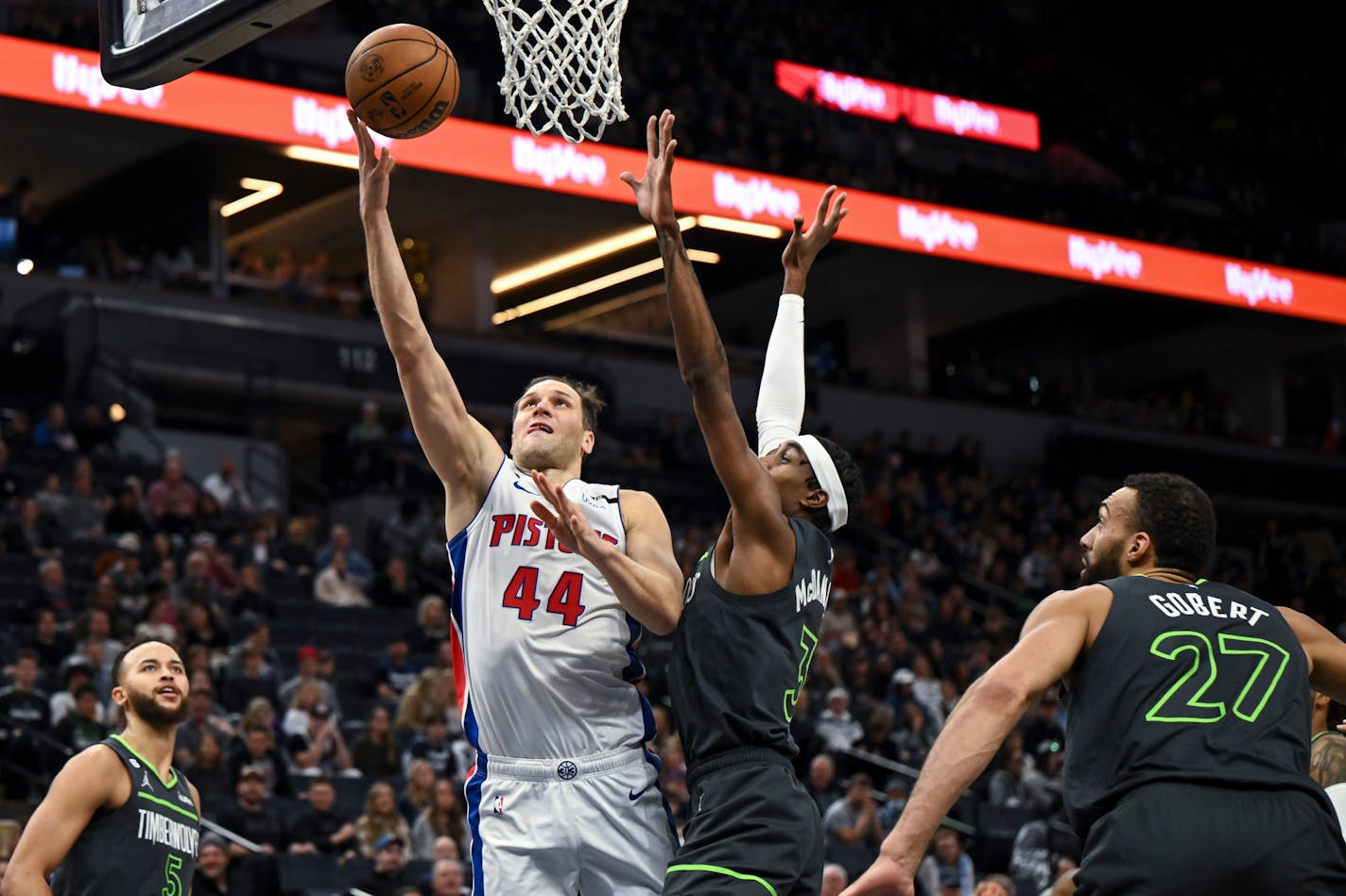 Detroit Pistons forward Bojan Bogdanovic (44) scores a layup during the first quarter against Minnesota Timberwolves forward Jaden McDaniels (3) Saturday, Dec. 31, 2022 at Target Center in Minneapoli, Minn... ] AARON LAVINSKY • aaron.lavinsky@startribune.com