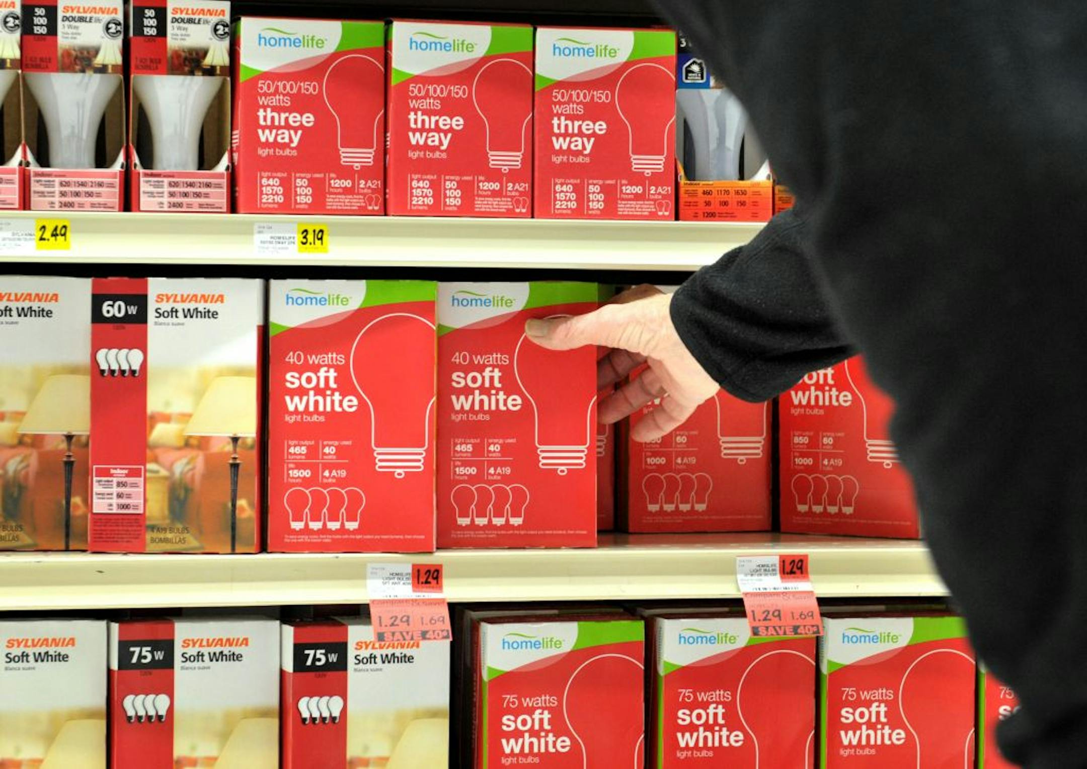 A Cub Foods customer grabbed for some light bulbs. Wal-Mart has been aggressively courting Cub's customers.