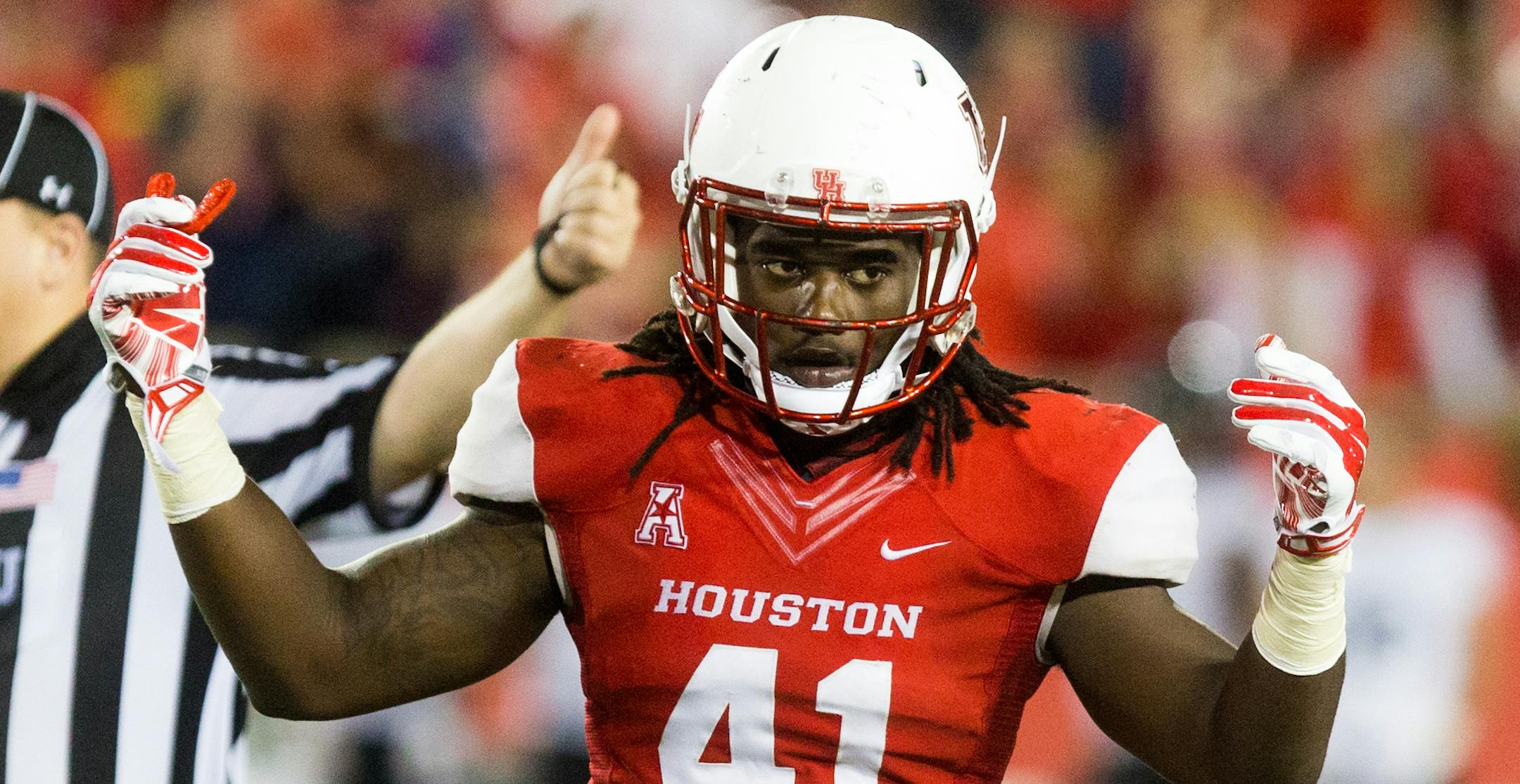 Houston's Steven Taylor (41) motions to the crowd to make some noise during the second half of an NCAA college football game at TDECU Stadium, Saturday, Nov. 7, 2015, in Houston. Houston defeated Cincinnati 33-30. (AP Photo/Juan DeLeon) ORG XMIT: TXJD