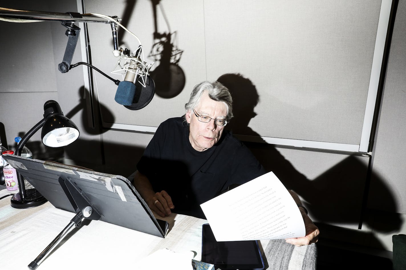 Stephen King records an audiobook in New York last July. The Portland Press Herald in Maine said it would bring back its local book reviews if the author and his followers brought in 100 new subscriptions.