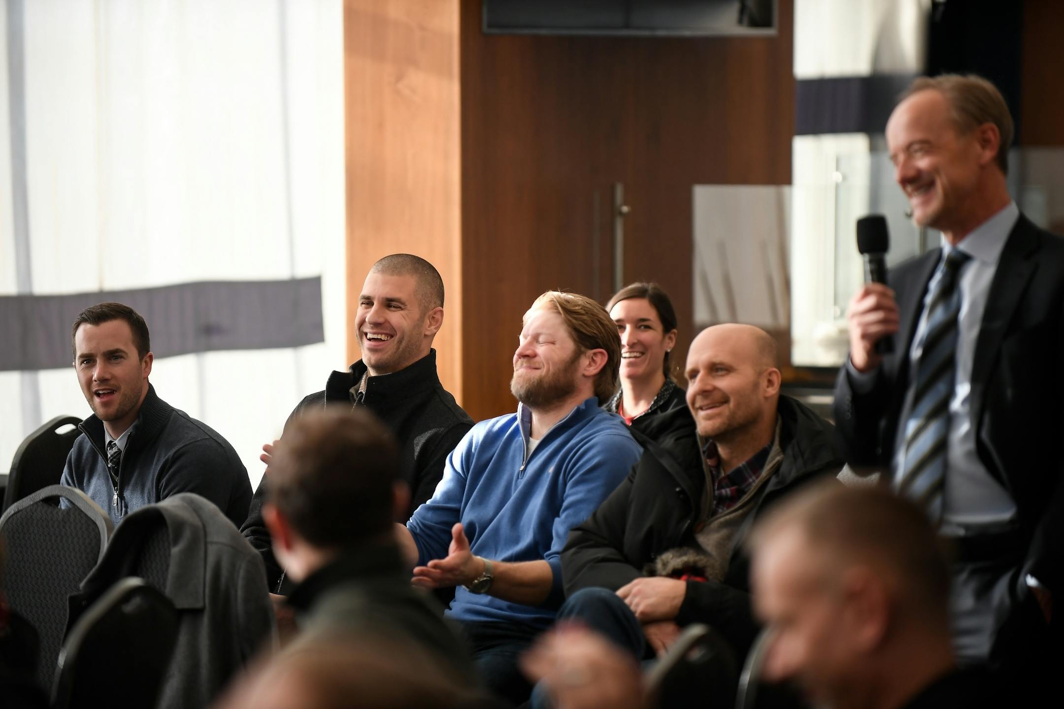Twins first baseman Joe Mauer, left, of center, laughed as team owner Jim Pohlad made remarks during former first baseman Justin Morneau's retirement press conference Wednesday afternoon.
