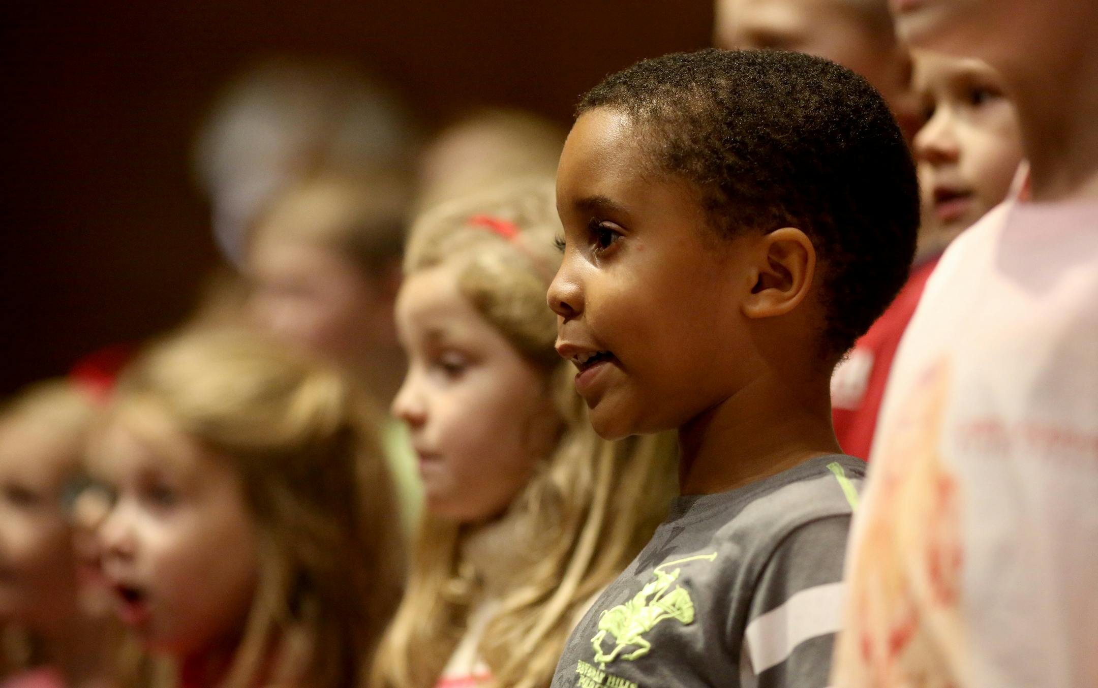 Faraja Mushi, 5, sang along with the rest of the choir as they rehearsed for their Christmas Eve concert. ] (KYNDELL HARKNESS/STAR TRIBUNE) kyndell.harkness@startribune.com The children's choir rehearsal for Christmas Eve service at St Phillip the Deacon Lutheran Church in Plymouth , Min., Wednesday December 22, 2015.