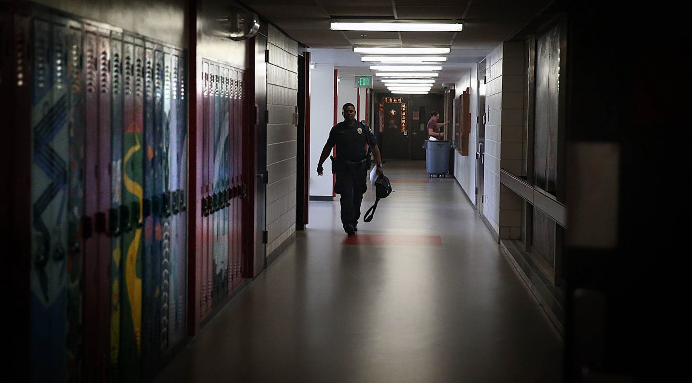 Cortez Hull, school resource officer (SRO) at Highland Park High School in St. Paul, monitored the hallways as classes let out for the day.