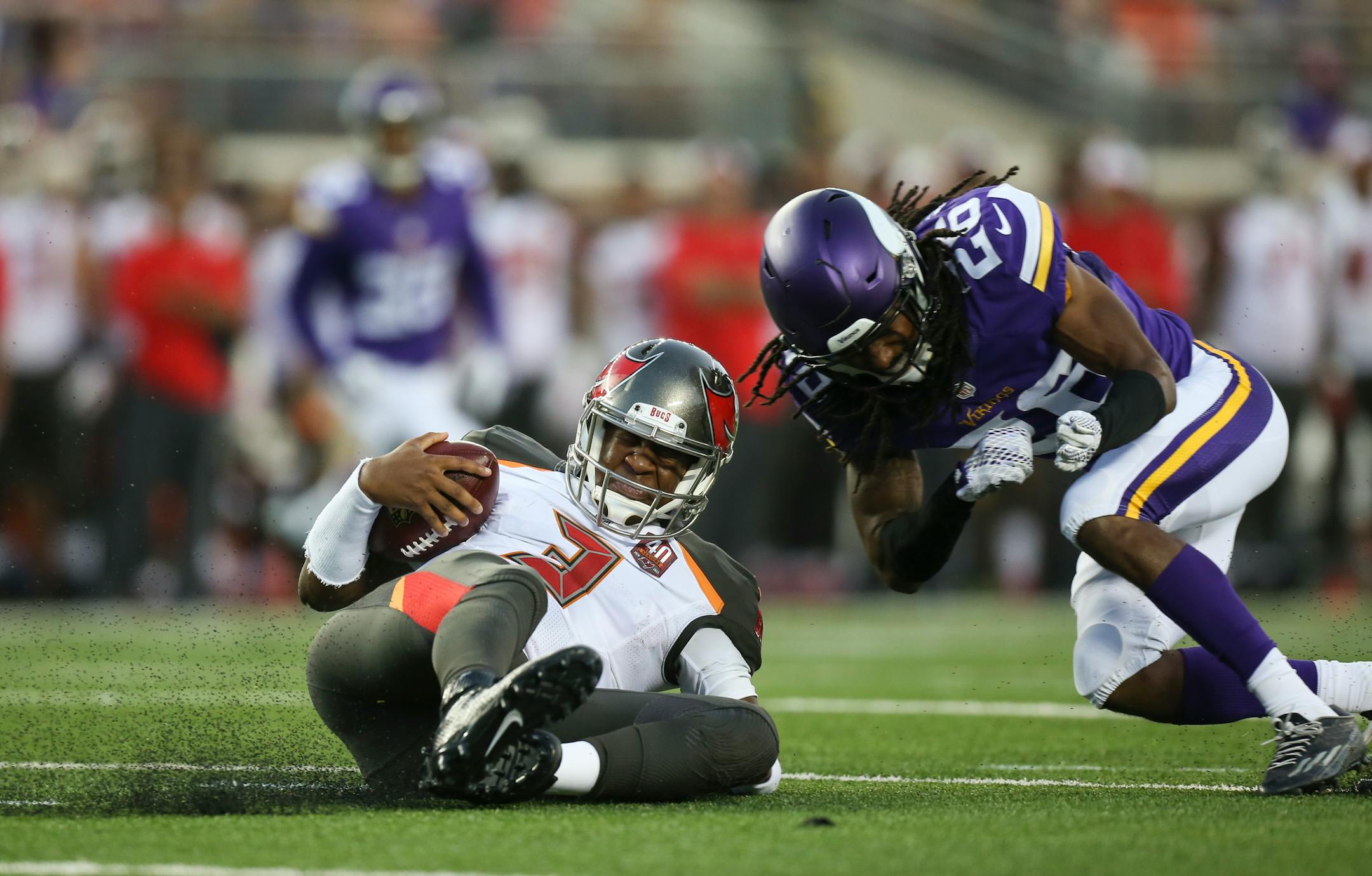 Vikings cornerback Trae Waynes hit Buccaneers quarterback Jameis Winston during a second-quarter scramble on Saturday night.