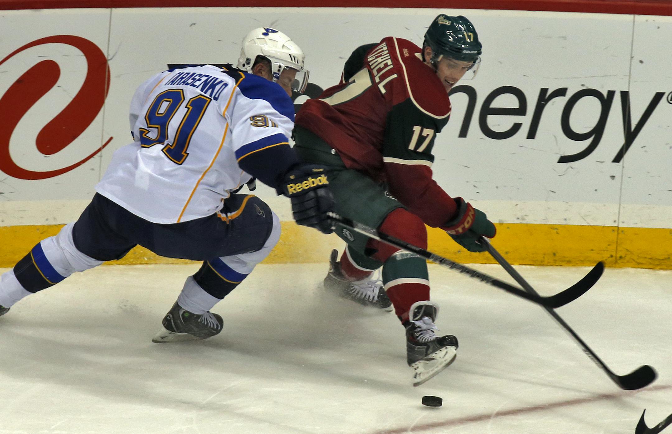Minnesota Wild vs. St. Louis Blues hockey. Blues Vladimir Tarasenko and Wild Torrey Mitchell fought for control of the puck in first period action. (MARLIN LEVISON/STARTRIBUNE(mlevison@startribune.com)