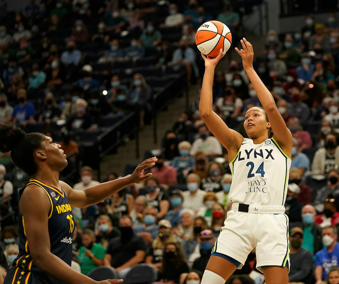 Minnesota Lynx forward Napheesa Collier (24) shot over Indiana Fever center players Teaira McCowan (15) during the quarter of the Lynx 90-80 win at the Target Center Sunday in Minneapolis. ]