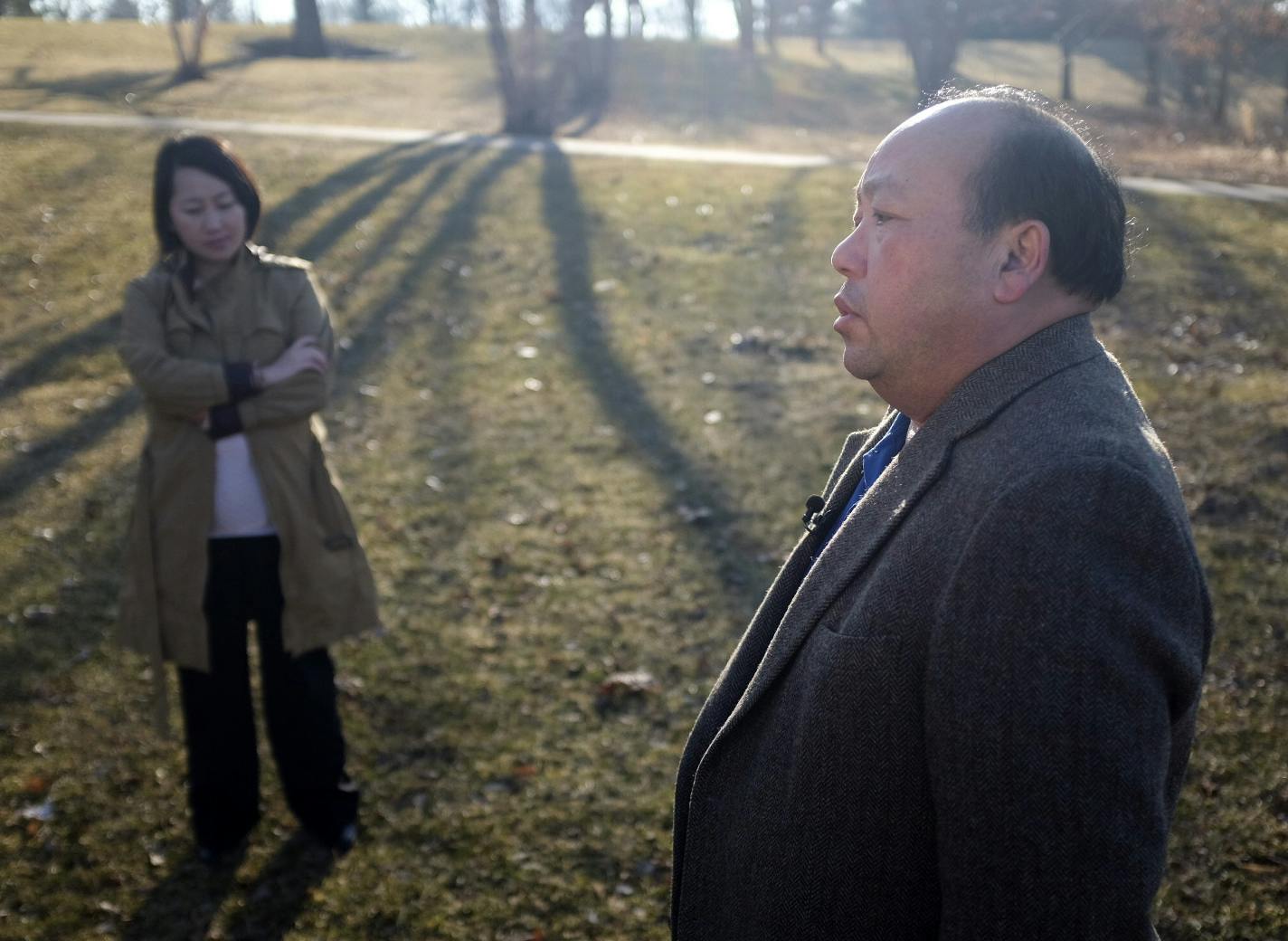 Kao Kalia Yang listened as her father, Bee Yang, sang a traditional Hmong song poem.