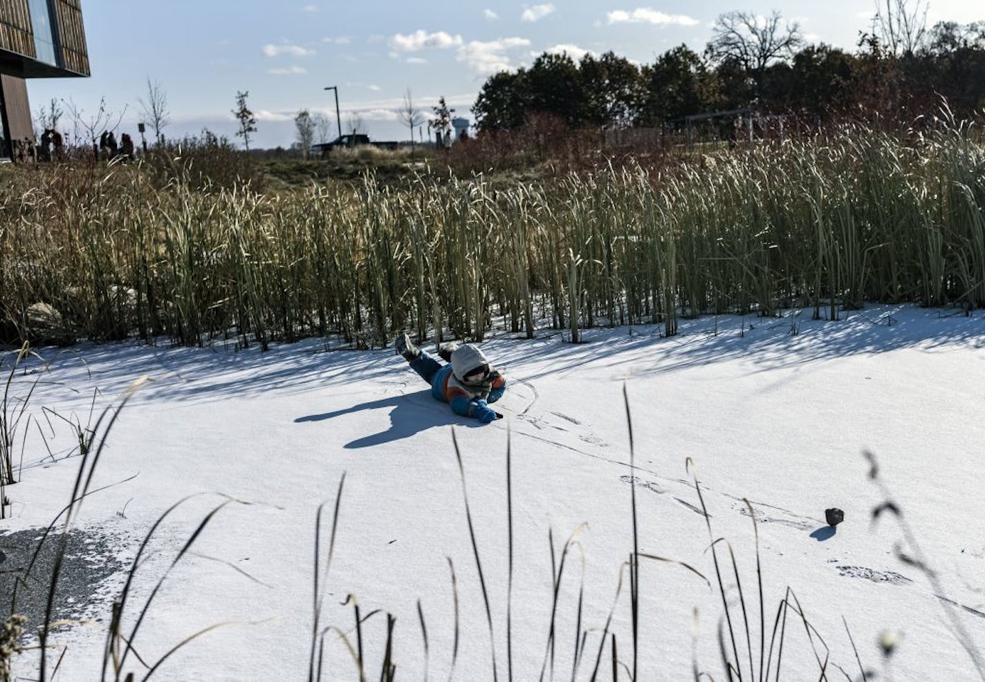 Raymond Hoisington, 9, bowled a stone across a small frozen pond at the Bell Museum where he was with his family to watch the transit of Mercury across the sun on Monday, Nov. 11.