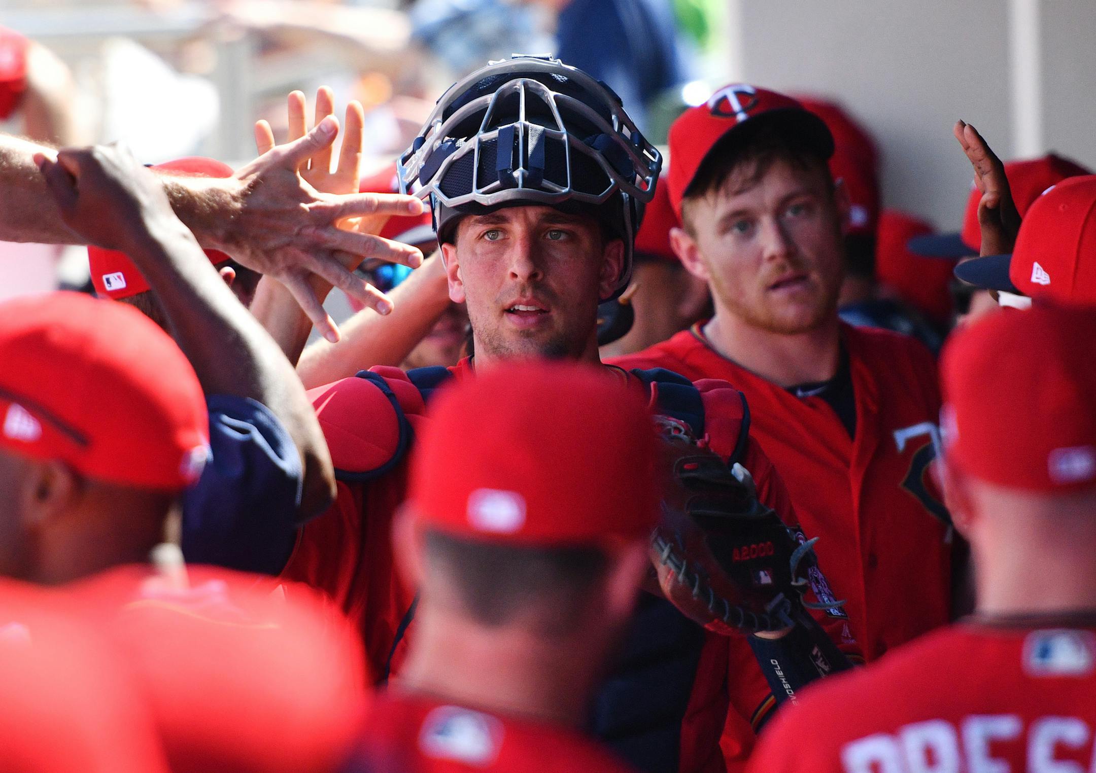 Twins catcher Jason Castro (15) celebrated with teammates after the Ray's fourth inning. ] MARK VANCLEAVE &#xef; mark.vancleave@startribune.com * The Tampa Bay Rays played the Minnesota Twins at Hammond Stadium in Fort Myers, Florida on Sunday, Feb. 25, 2018.