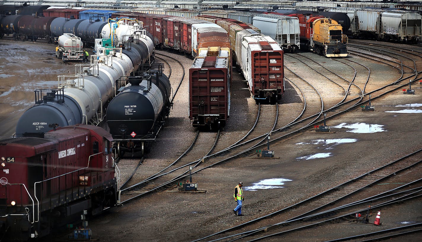 A railroad workman walked toward a switch along tracks at the Minnesota Transfer Railroad Yard in St. Paul. The worker threw a switch, which allowed a series of rail cars to change from one set of tracks to another. ]JIM GEHRZ &#x2022; james.gehrz@startribune.com / St. Paul, MN / April 10, 2015 /11:00 AM ORG XMIT: MIN1504101513023058