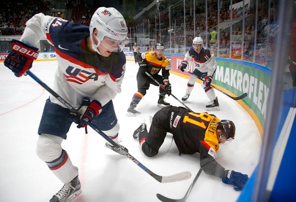 In this May 15, 2016 file photo, the United States' Auston Matthews, left, fought for the puck with Germany's Torsten Ankert during a Hockey World Cha