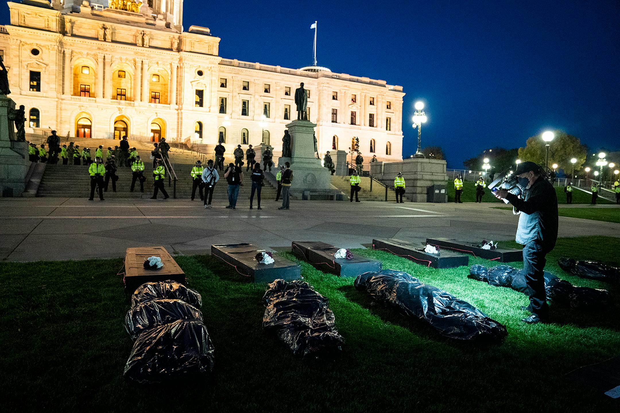 Families of those killed by police marched with hundreds of supporters in "The Secret March" down University Avenue to the Capitol in St. Paul. There they dropped several effigies of dead bodies and coffins along with a list of demands.