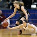 Academy of Holy Angels' Laura Bagwell-Katalinich, left, and Thief River Falls' Kylea Praska battled for the ball during the first half of the Class 3A