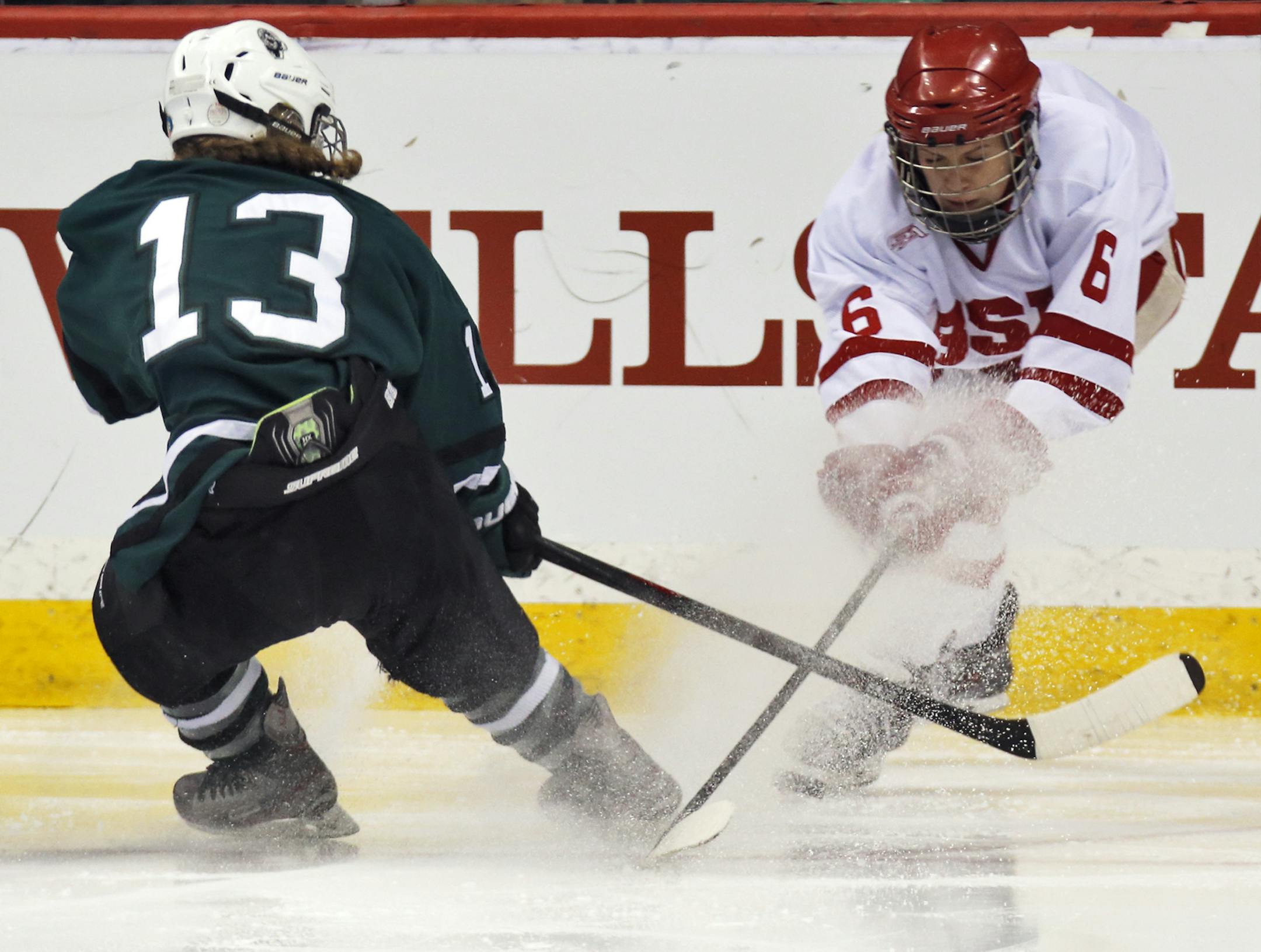 Girls State Hockey Tournament - Class 2A - Roseau Rams vs. Benilde-St. Margaret's Red Knights. Rams Josee Lundgren (13) and Red Knights Heather Mostrom (6) skated after the puck. (MARLIN LEVISON/STARTRIBUNE(mlevison@startribune.com)