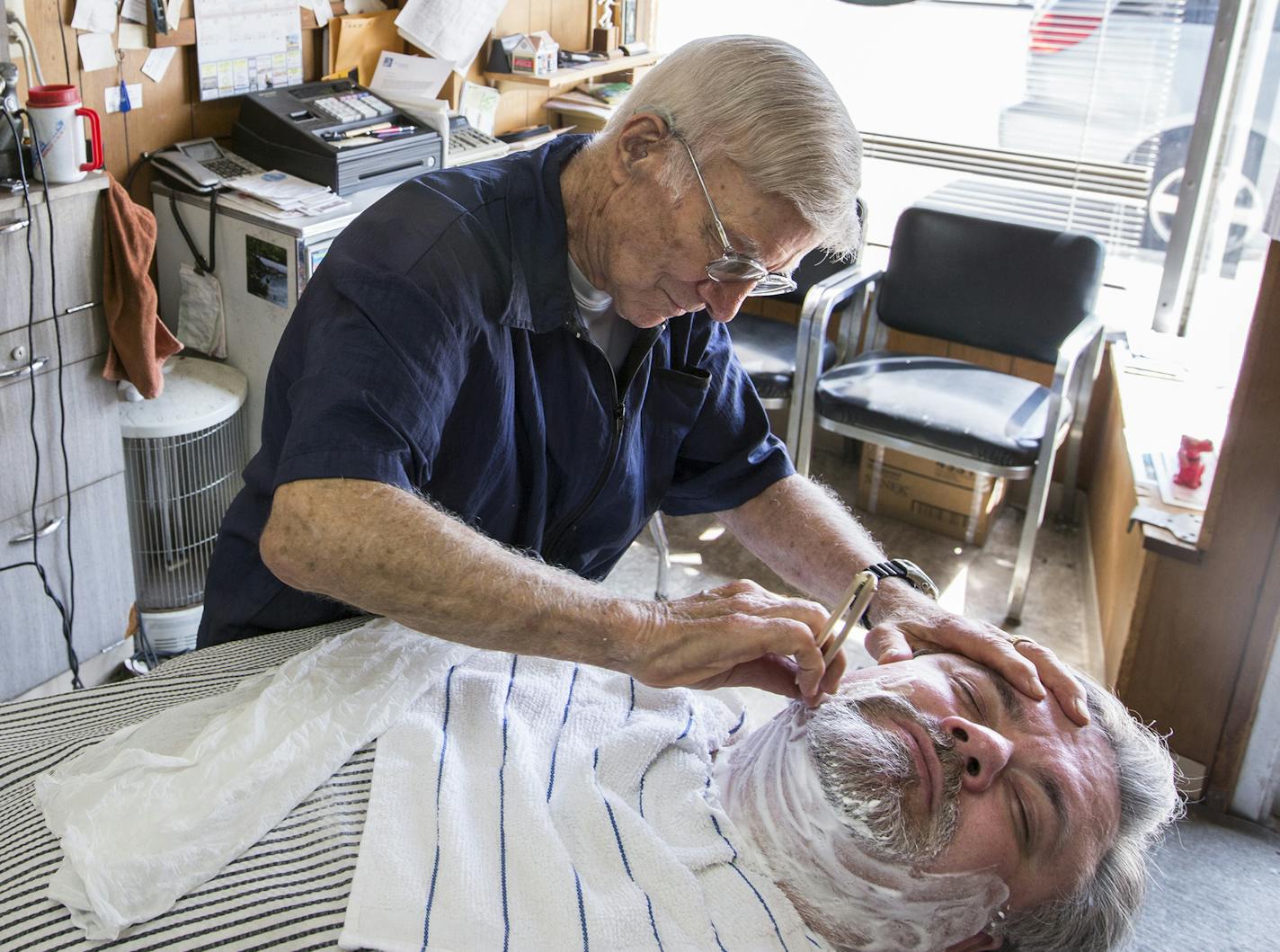 Jeff DeLozier finishes up a haircut with a straight razor neck shave for Luthanen. &#x201c;Outside a sauna and a dip in a northern Minnesota lake, nothing makes you feel cleaner than a shaved neck,&#x201d; says Luthanen.