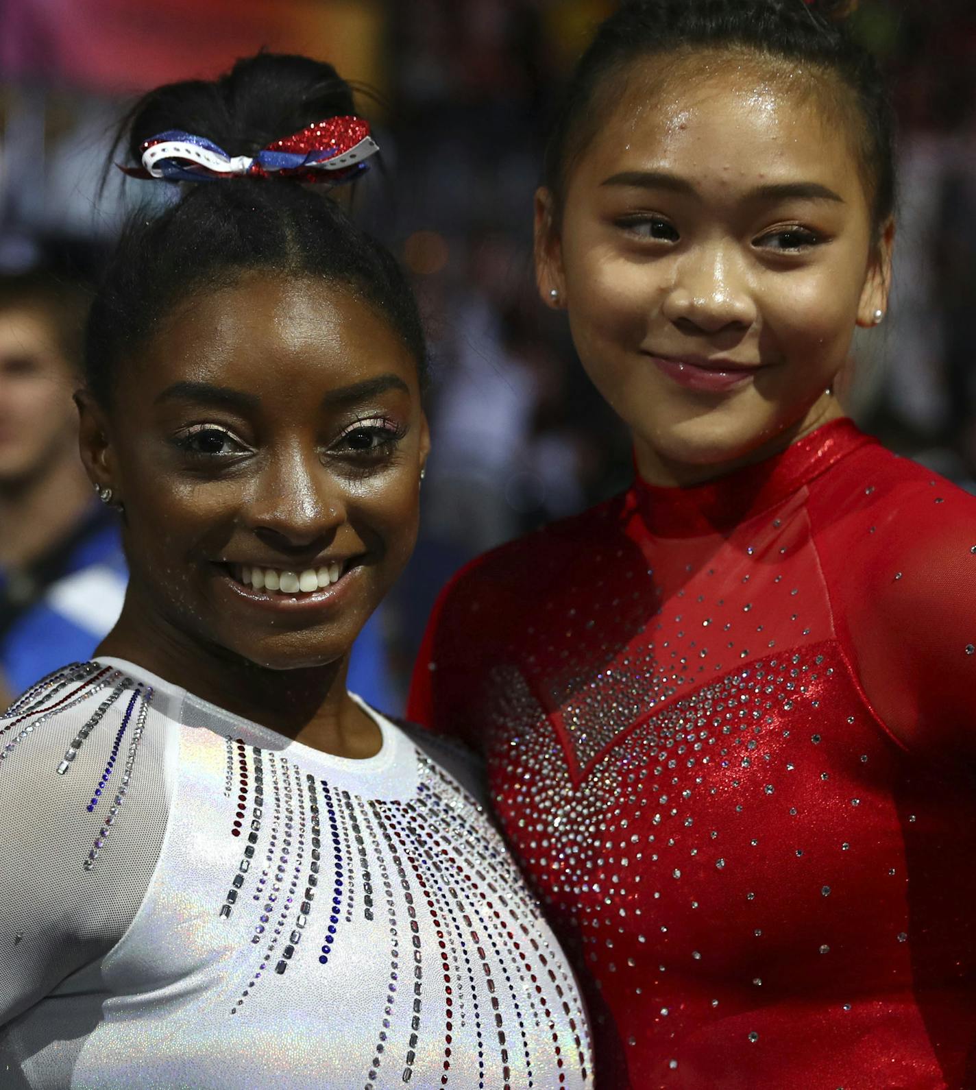 Gold medal winner Simone Biles of the U.S., left, and her team mate Sunisa Lee pose after the women's all-around final at the Gymnastics World Championships in Stuttgart, Germany, Thursday, Oct. 10, 2019. (AP Photo/Matthias Schrader)