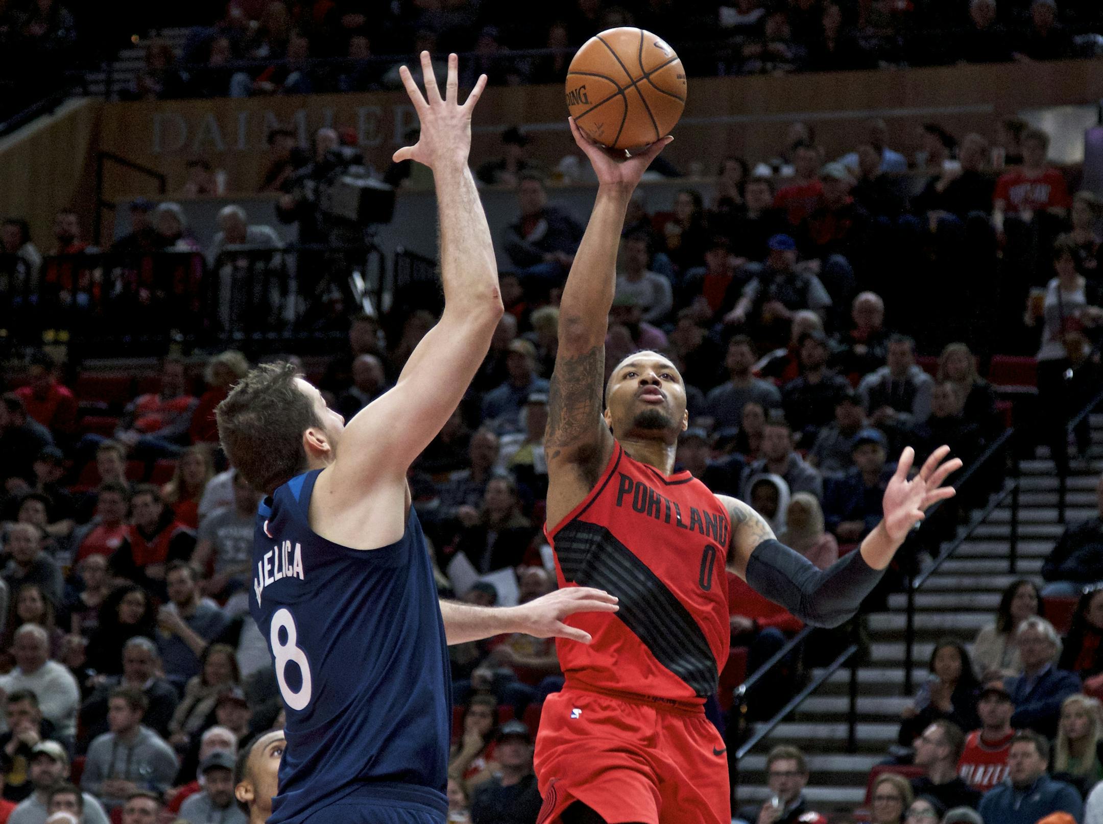 Portland Trail Blazers guard Damian Lillard shoots over Minnesota Timberwolves forward Nemanja Bjelica during the second half of an NBA basketball game in Portland, Ore., Thursday, March 1, 2018. (AP Photo/Craig Mitchelldyer)
