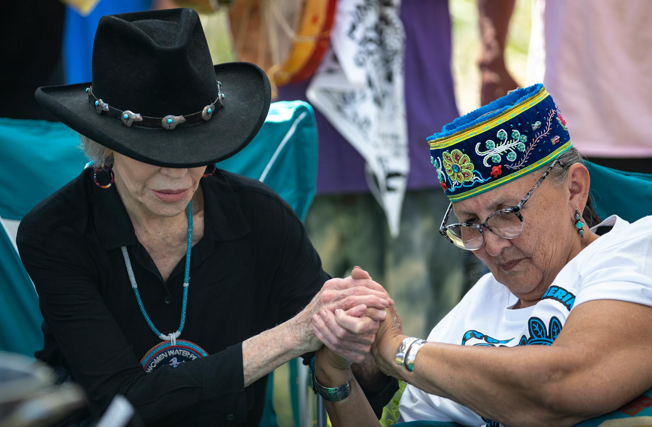 Actress and activist Jane Fonda locked hands with Grandmother Mary Lyons after they prepared to performed a traditional water ceremony on Monday.