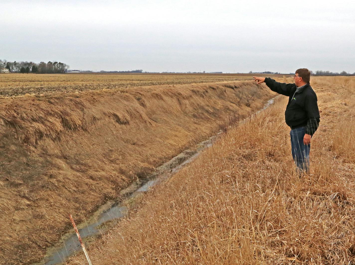 John Mages farms near Belgrade, Minn., and has already planted buffers only a private ditch and a lake that border his property. The neighboring landowner on the other side of the ditch shown has not planted a buffer.