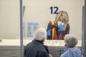 Staff were on hand to guide and help people through the new saliva COVID-19 testing site at the Minneapolis-St. Paul International Airport, Thursday, 