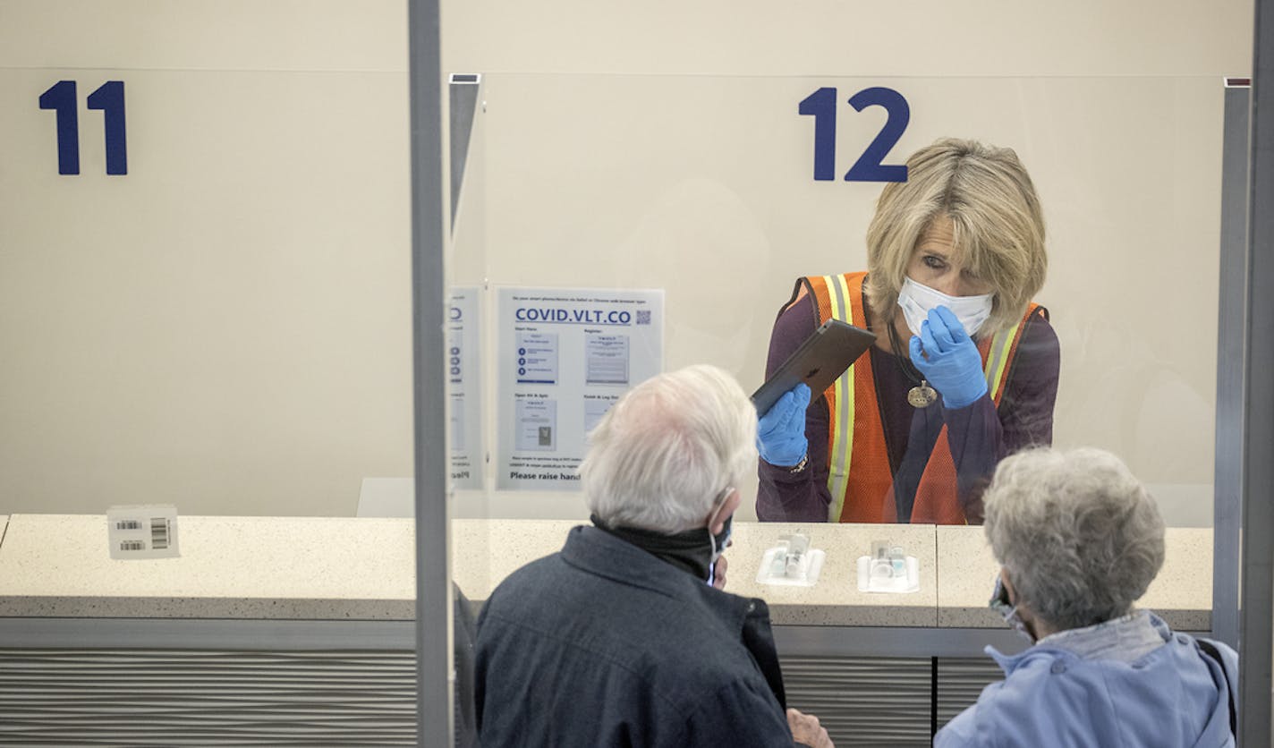 Staff were on hand to guide and help people through the new saliva COVID-19 testing site at the Minneapolis-St. Paul International Airport, Thursday, Nov. 12, 2020.