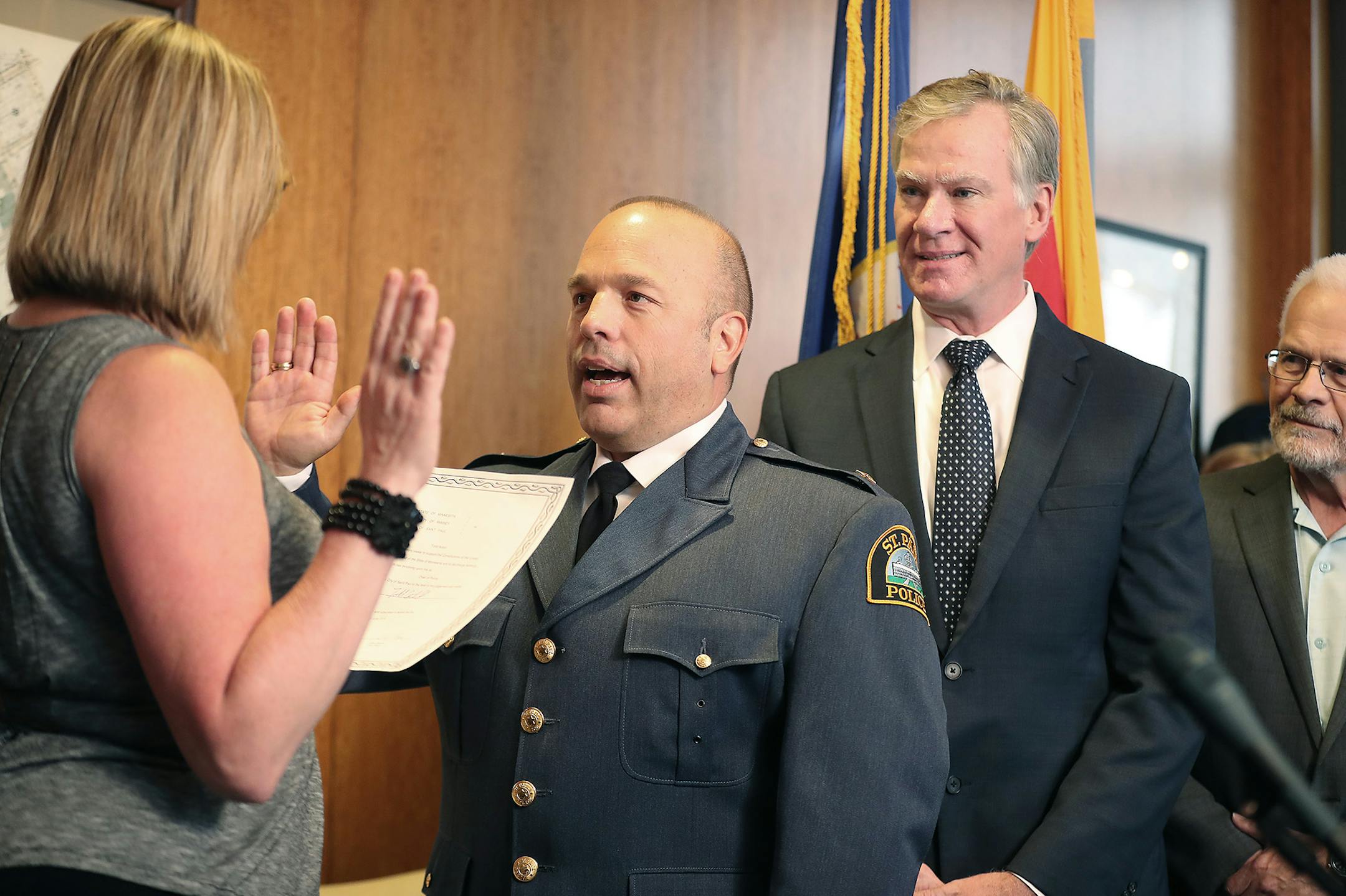 New St. Paul Police Chief Todd Axtell stood before Mayor Chris Coleman's as he was officially sworn in as police chief, Thursday, June 23, 2016 in St. Paul, MN. ] (ELIZABETH FLORES/STAR TRIBUNE) ELIZABETH FLORES • eflores@startribune.com