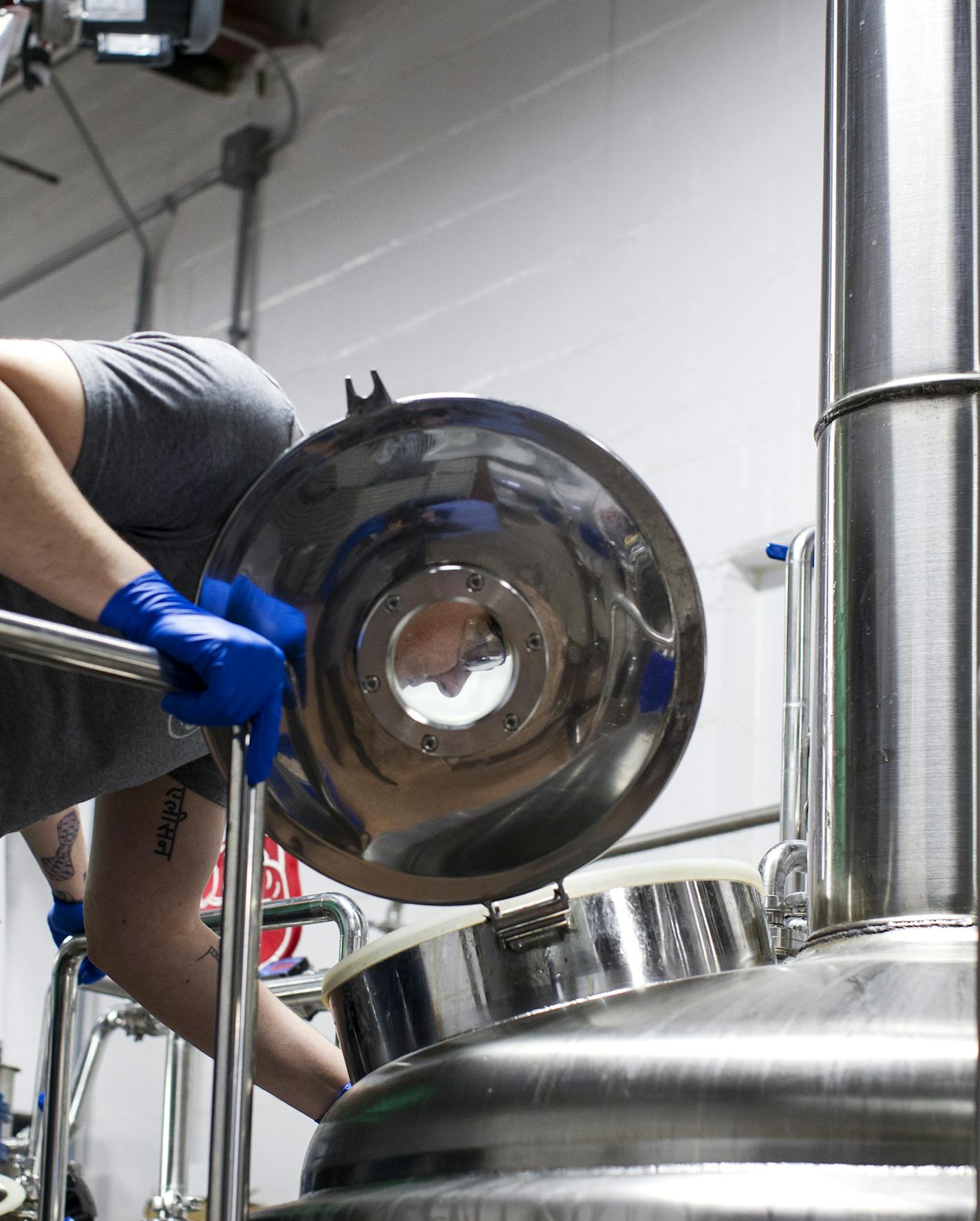 Jason Westplate checked on the progress in the fermentation tank at Burning Brothers Brewing in St. Paul.