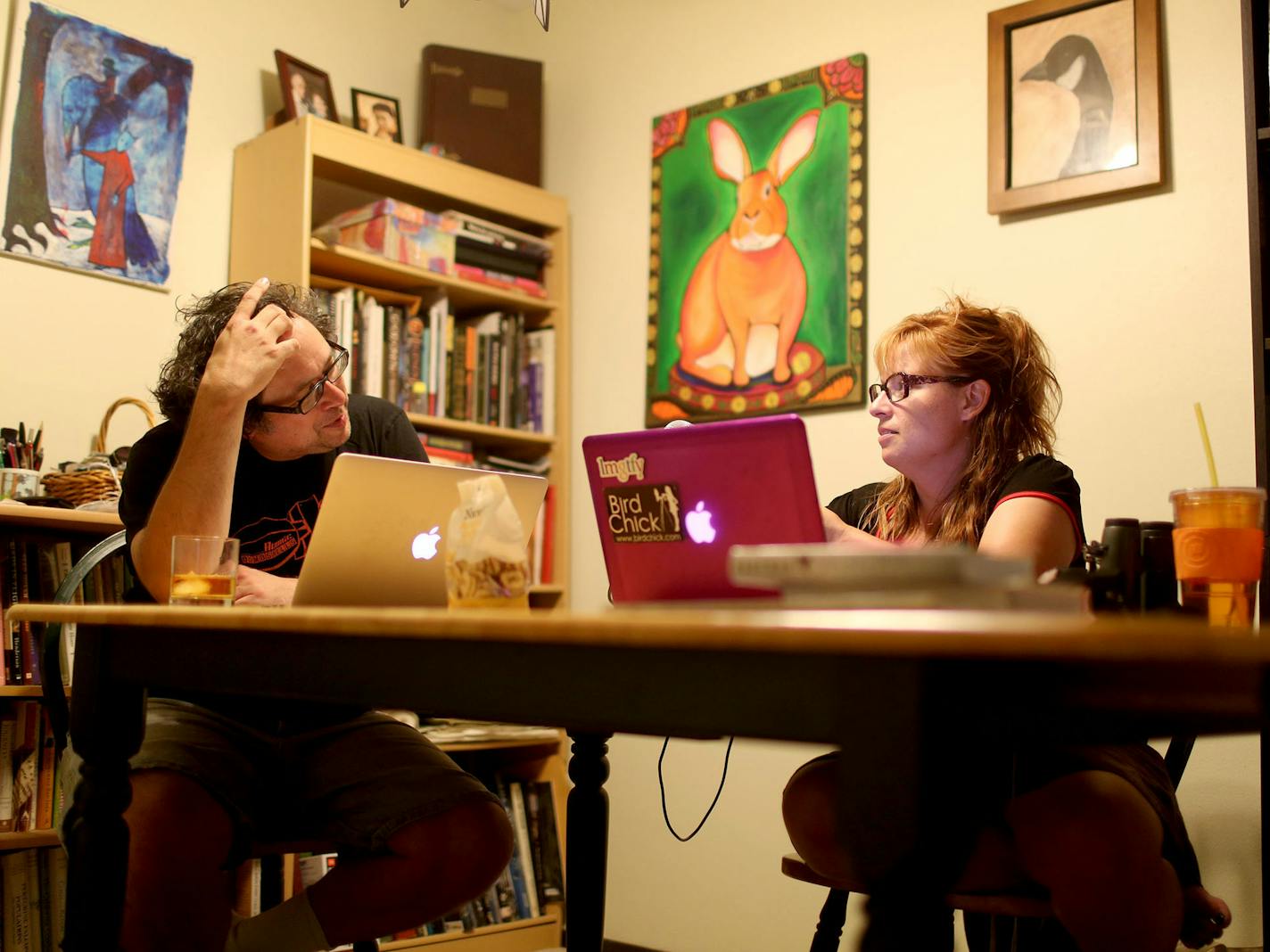 Passionate birder Sharon Stiteler, right, and her non-birding husband Bill Stiteler, nicknamed "non-birding Bill," have a humorous podcast about birding that they produce in their Minneapolis apartment. During the lighthearted podcast, they always drink whiskey. Here, the couple was seen doing a podcast from their home Friday, Aug. 12, 2016, in Minneapolis, MN.](DAVID JOLES/STARTRIBUNE)djoles@startribune There's a new wave of DIY podcasters, using a medium that allows anyone who has something to