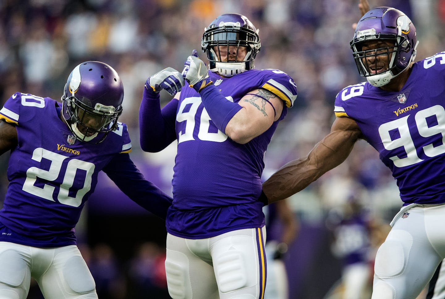 Vikings defensive lineman Brian Robison, center.