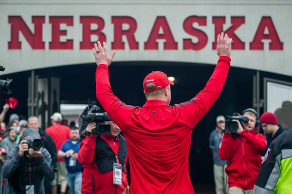 Nebraska coach Scott Frost waved to fans while walking off the field following an intrasquad game in 2018.
