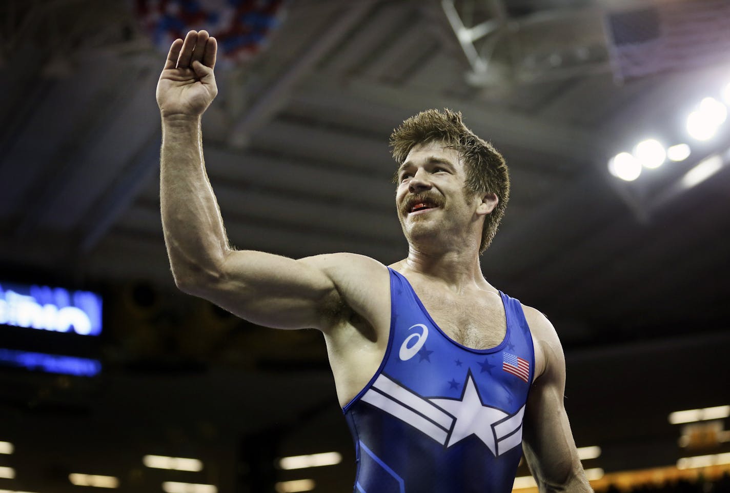 Andy Bisek celebrated his victory over Geordan Speiller at 75kg in a Greco-Roman bout that earned him a spot on the Olympic team.