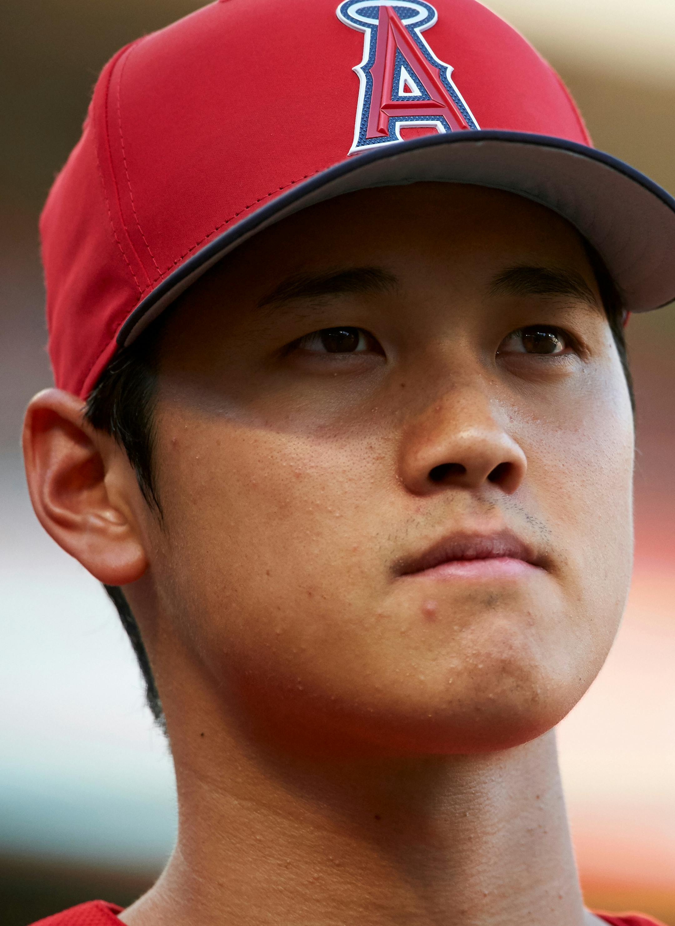 FILE - In this April 10, 2018, file photo, Los Angeles Angels' Shohei Ohtani waits during batting practice before the team's baseball game against the Texas Rangers in Arlington, Texas. Ohtani eagerly bounces into the cage when it's his turn in batting practice _ and then puts on an impressive show. The rookie two-way sensation is always ready to go, whether hitting or pitching for the Angels. (AP Photo/Cooper Neill, File)