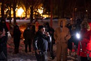 Demonstrators listened to Toussaint Morrison&nbsp;&nbsp;&nbsp; while gathered outside homes in the Cedar-Isles-Dean on Sunday night, February 6, 2022 