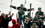Minnesota Wild left wing Kevin Fiala (22), from left, celebrated the game-tying goal by Minnesota Wild left wing Kirill Kaprizov (97) with Minnesota W