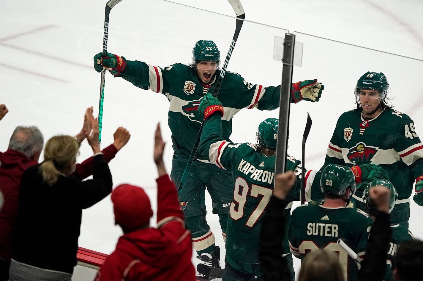 Minnesota Wild left wing Kevin Fiala (22), from left, celebrated the game-tying goal by Minnesota Wild left wing Kirill Kaprizov (97) with Minnesota Wild defenseman Ryan Suter (20) and Minnesota Wild center Victor Rask (49) during the third period. ] LEILA NAVIDI • leila.navidi@startribune.com