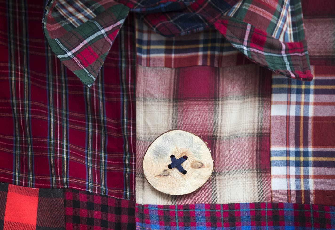 Paul Bunyan's buttons are made from small logs.