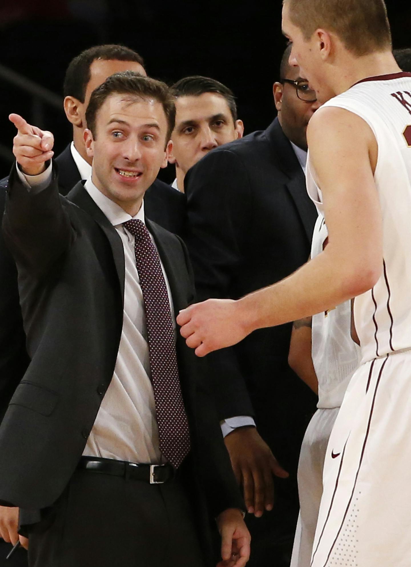 Minnesota head coach Richard Pitino, left, directs forward Joey King (24) during the first half of an NCAA college basketball game against St. John's in New York, Wednesday, Nov. 26, 2014. (AP Photo/Kathy Willens)