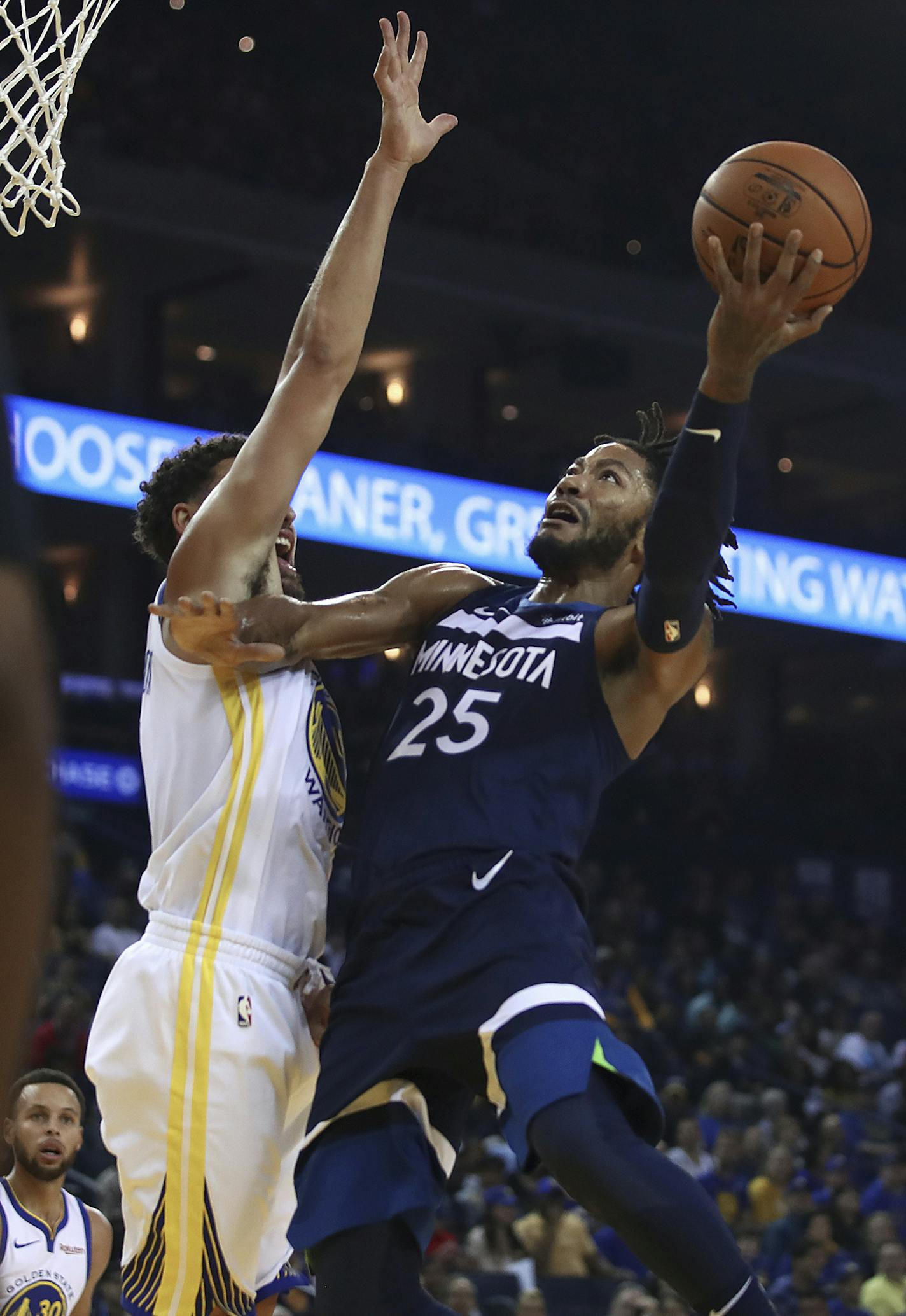 Minnesota Timberwolves' Derrick Rose, right, shoots against Golden State Warriors' Klay Thompson during the first half of an NBA preseason basketball game Saturday, Sept. 29, 2018, in Oakland, Calif. (AP Photo/Ben Margot)