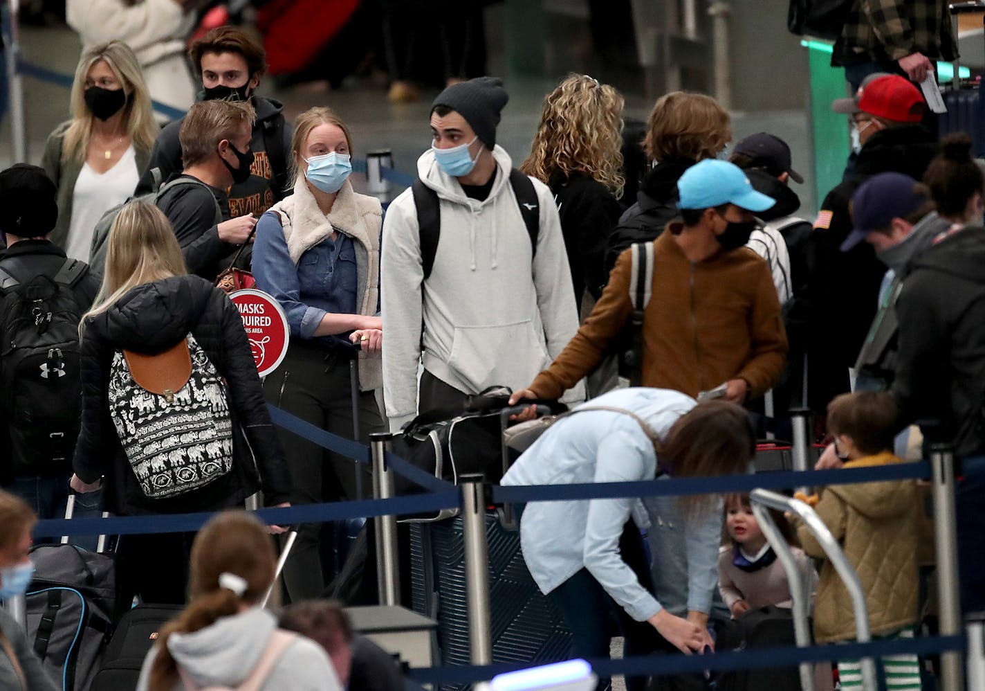 Holiday travelers crowded the ticketing area of Terminal One Wednesday at Minneapolis-St. Paul International Airport.