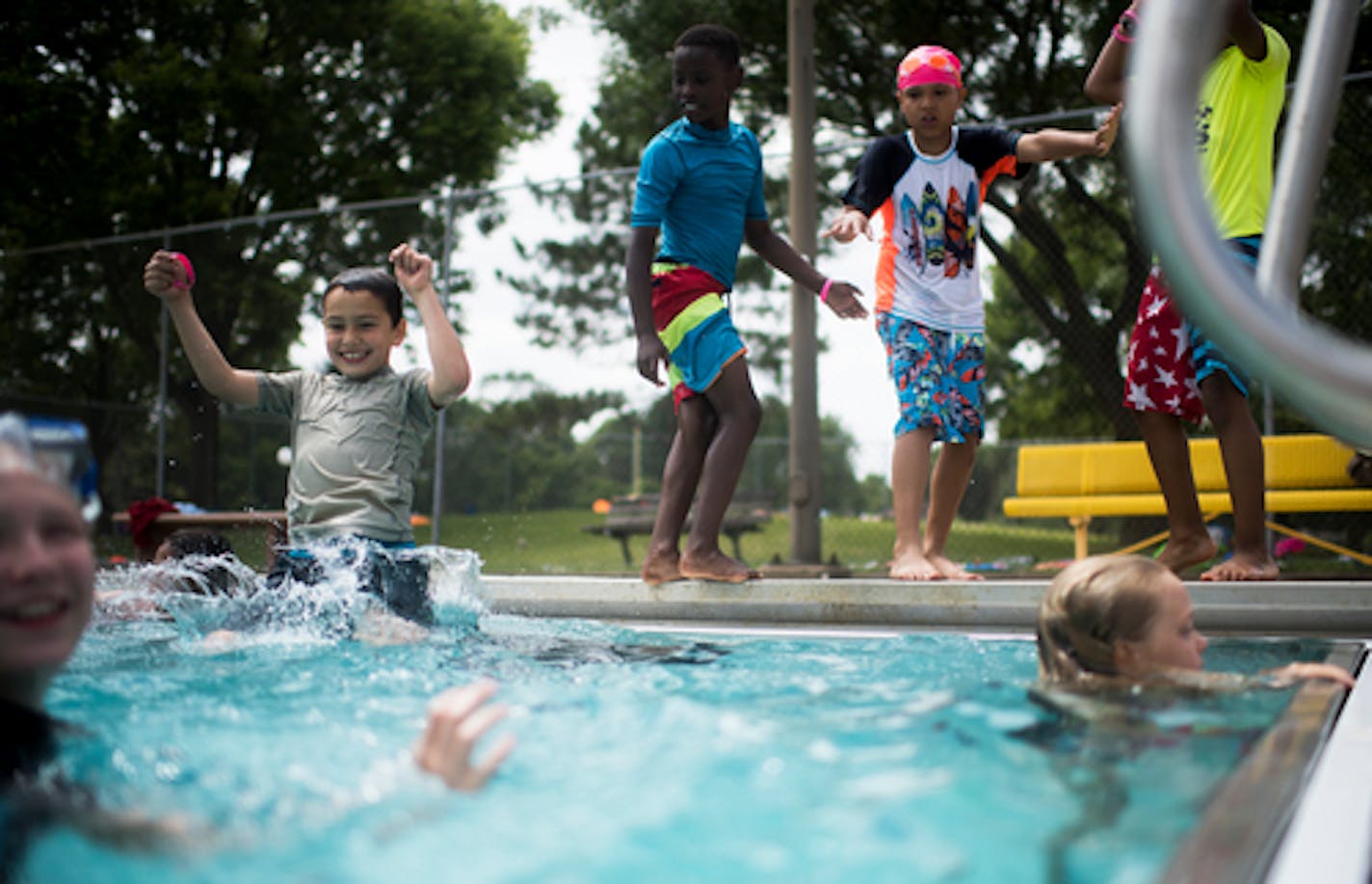 Lucas Lora-Versaw, 8, a rising 4th grader at Emerson SILC, jumped into the pool among friends after swim lessons on Friday. ] Isaac Hale • isaac.hale@startribune.com The Minneapolis Park and Recreation Board along with Abbey's Hope Charitable Foundation held swimming lessons for school children and the public at North Commons Water Park in Minneapolis, MN, on Friday, June 24, 2016. After the swimming lessons, Blue Moo ice cream gave out free ice cream and ice cream bars, and some children returned to the pool at 1 p.m. when the water park formally opened.