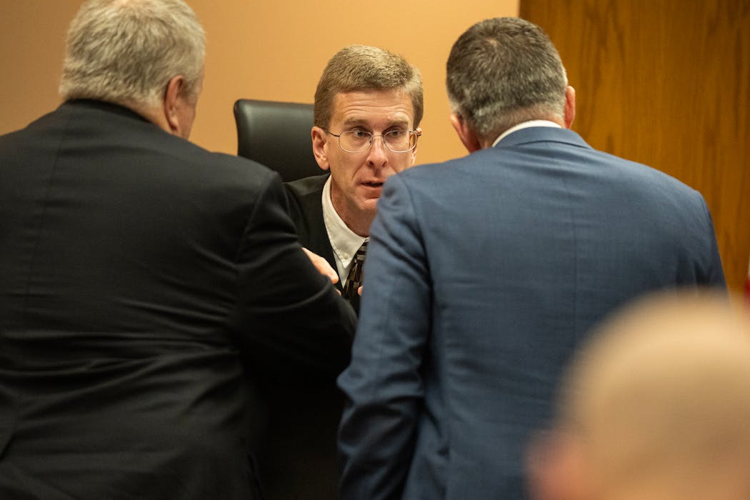 Judge Michael Waterman talked with two of the opposing attorneys in a sidebar on Monday.