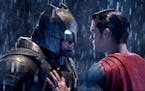 This image released by Warner Bros. Pictures shows Ben Affleck, left, and Henry Cavill in a scene from, "Batman v Superman: Dawn of Justice." (Clay En