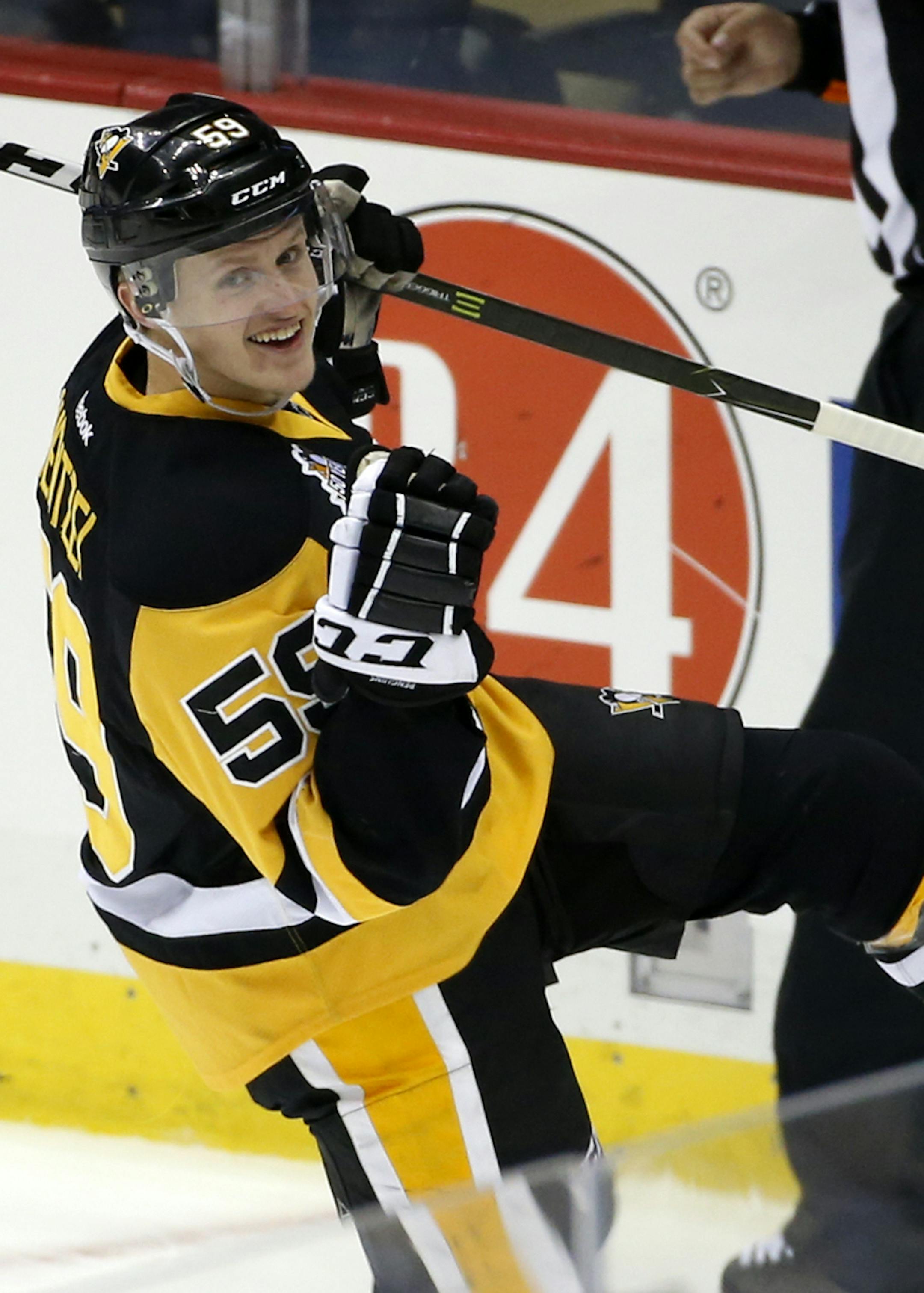 Pittsburgh Penguins' Jake Guentzel (59) celebrates his second goal of the first period during an NHL hockey game against the New York Rangers in Pittsburgh, Monday, Nov. 21, 2016. (AP Photo/Gene J. Puskar) ORG XMIT: PAGP101
