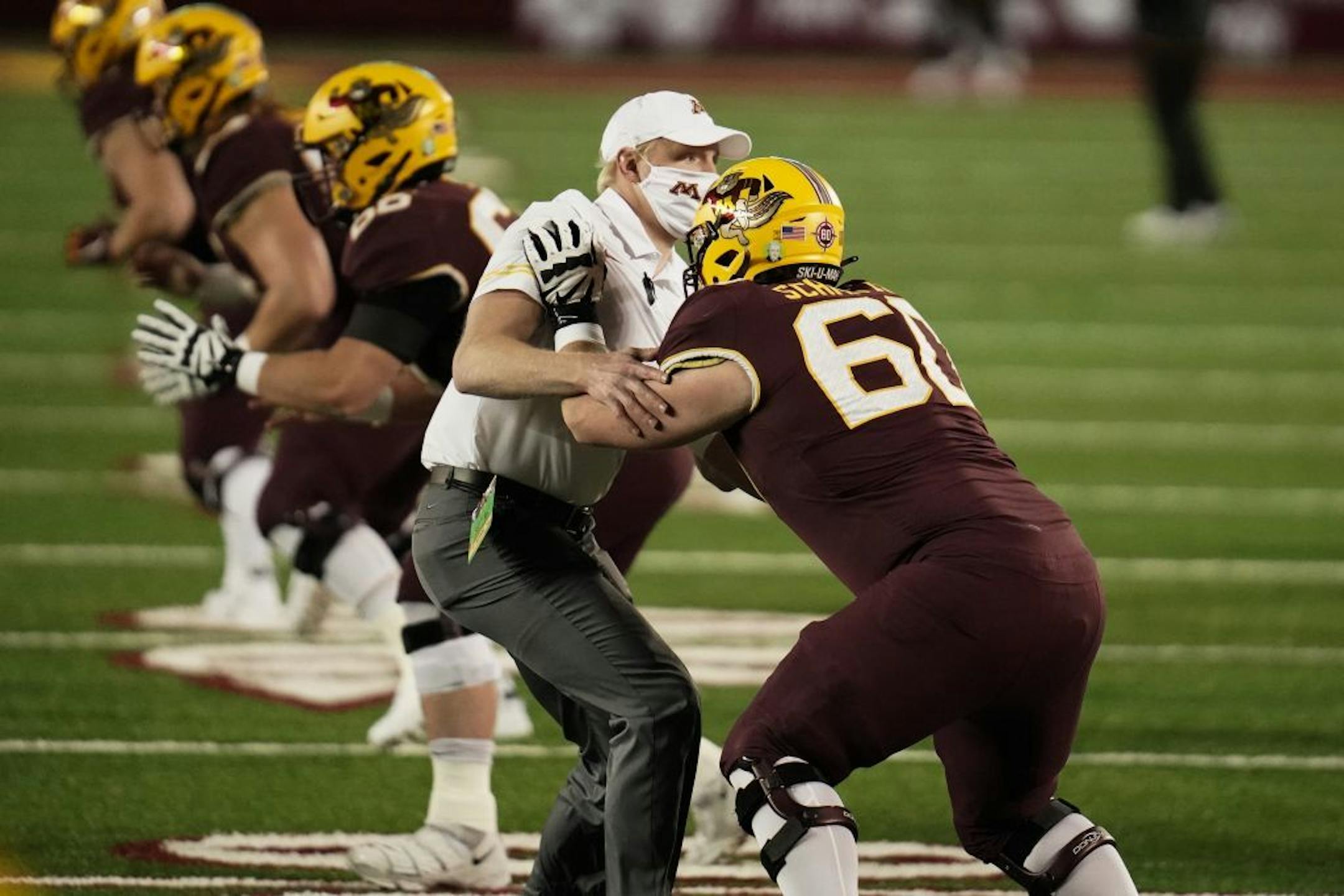 Minnesota Gophers offensive lineman John Michael Schmitz (60) warmed up before the game.