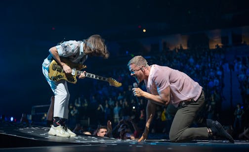 Lead singer Dan Reynolds with Imagine Dragons guitarist Wayne Sermon performing early in the band's set Sunday night, February 27, 2022 at Target Center in Minneapolis, Minn. Imagine Dragons' Mercury World Tour made a stop at Target Center with the Danish singer MØ and her band opening. ] JEFF WHEELER • Jeff.Wheeler@startribune.com