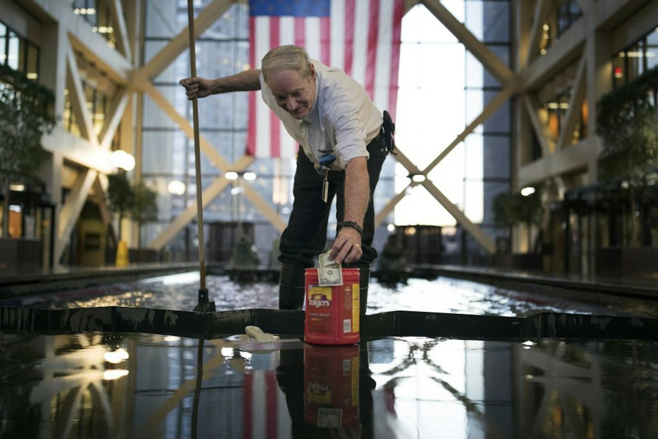 Dave Getten cleaned out the pool at Hennepin County Government Center Tuesday January 3,2017 in Minneapolis , MN.